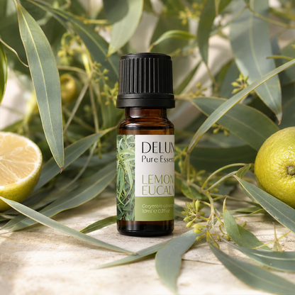 Lemon Eucalyptus Pure Essential Oil with fresh eucalyptus foliage and lemon accents
