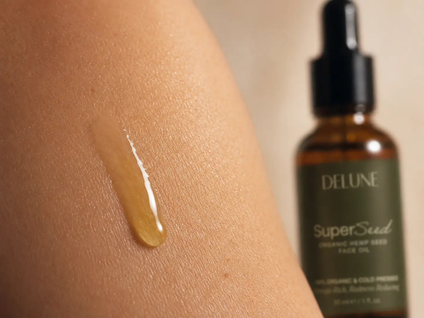 A drop of hemp seed oil on skin